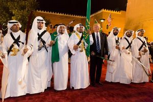 Donald_Trump_with_ceremonial_swordsmen_on_his_arrival_to_Murabba_Palace,_May_2017